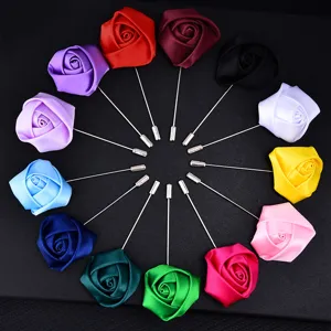 Detailed view of colorful satin rose lapel pins, perfect for weddings and party events.