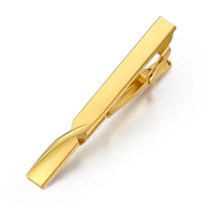 High-polished brass tie clip for men and women, minimalist metal duckbill clip detail.