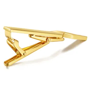Glossy brass tie clip for men and women, elegant metallic duckbill clasp for business suits.