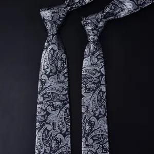 Classic black grey paisley pattern necktie detail, elegant men business formal accessory.