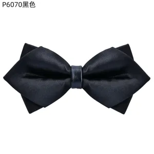 Black pointed bow tie for men wedding suit, classic tuxedo accessory with detailed texture.