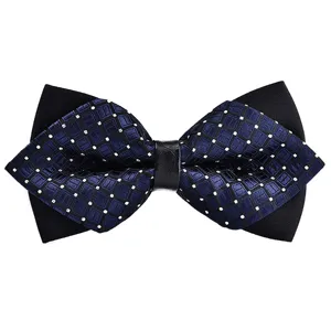 Detailed close-up of a double-layer men's bow tie with blue grid pattern and black fabric.