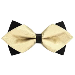 Detailed view of a stylish black and gold pointed bow tie, perfect for formal suits and weddings.