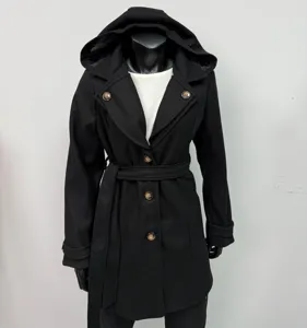 Detailed view of the black hooded wool coat showing buttons, belt, and fabric texture.