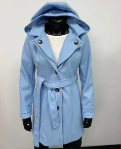 Detail shot of women's light blue hooded wool coat with belt and buttons, cozy autumn outerwear.