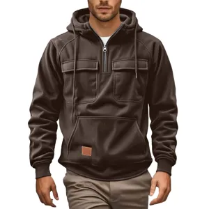 Men casual brown corduroy hoodie with quarter zip, dual chest pockets, and long sleeves for autumn.