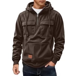 Detailed view of men's brown corduroy quarter-zip hoodie with pockets and hood.
