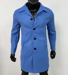 Close-up detail of the classic lapel single-breasted wool blend coat in vibrant blue.