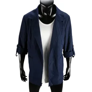 Detailed view of the dark blue women casual blazer cardigan with lapel and white top.