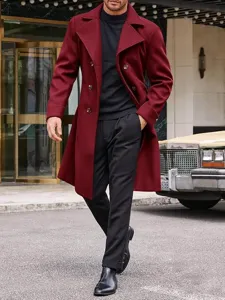 Close-up view of a stylish burgundy double-breasted wool trench coat for men, refined details.