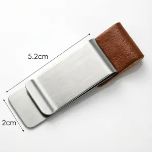 Stainless steel money clip with leather detail, durable pen holder for notebook planners.