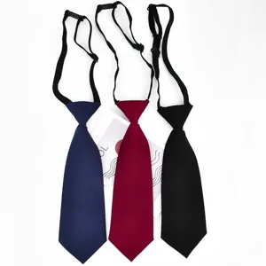 Closeup of solid color children pre-tied neckties with adjustable straps in multiple colors.