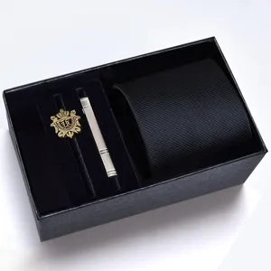 Men's black tie gift set detail showcasing the exquisite texture, elegant tie clip and decorative badge.