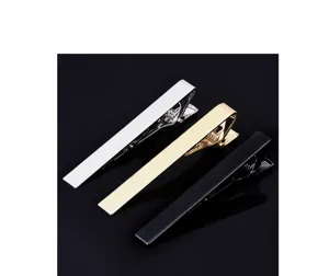 Classic brass tie clips set in silver, gold and black. Sleek minimalist design for men.