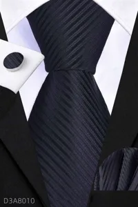 Business tie detail view showing fine twill fabric texture, matching cufflink and square.