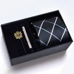 Men business tie gift box set featuring a striped tie, metal clip and decorative badge.
