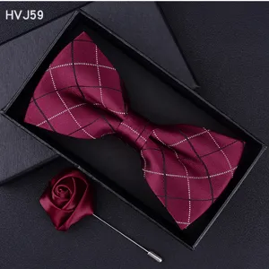 Burgundy plaid bow tie and rose lapel pin detail view inside black gift box display.