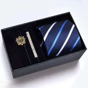 Detailed view of men's business blue striped tie gift set with metal clip and emblem pin.