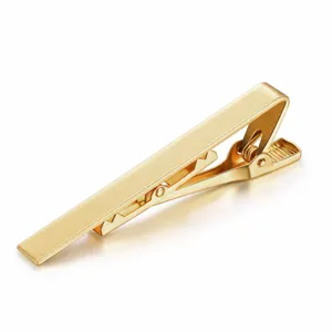 Gold tie clip detail shot showcasing the polished metallic surface and clasp mechanism.