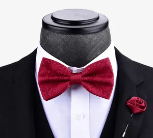 Burgundy patterned bow tie and rose lapel pin set detail for men's wedding and formal wear.