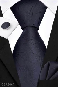 Men's business navy blue tie set with pocket square and matching cufflinks detail view.