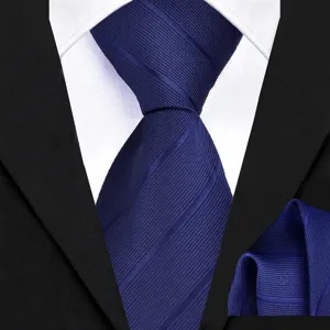 Close-up detail of the deep blue textured twill necktie and matching pocket square set.