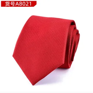 Close-up detail of a classic men's red diagonal twill business necktie fabric texture.