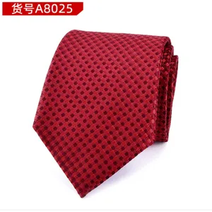 Close-up detail of red patterned men business necktie, classic textured fabric design for wedding.