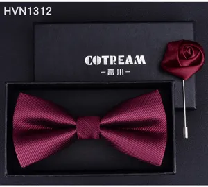 Burgundy bow tie and brooch set detail shot, elegant fabric texture with gift box display.