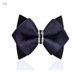 Detail shot of the elegant black and purple dotted bow tie featuring a sparkling rhinestone center ring.