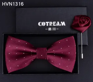 Detailed close-up showing the burgundy polka dot bow tie and matching satin rose pin.