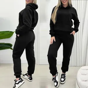 Detailed view of women black long sleeve hoodie and sweatpants two piece casual tracksuit set.