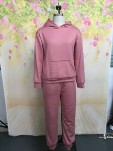 Solid pink hoodie and sweatpants two piece set, casual long sleeve outfit for women.