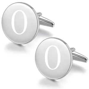 Detailed shot of round silver metal cufflinks with laser engraved letter design for men shirts.
