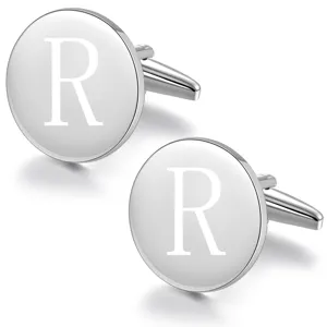 Detailed view of silver tone brass round cufflinks engraved with letter R for men dress shirts.