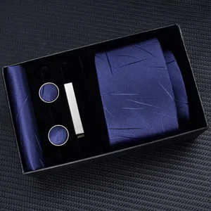 Men's navy blue tie gift set with pocket square cufflinks and tie clip detailed view
