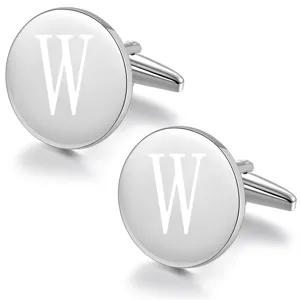 Close-up detail of silver tone round metal cufflinks featuring engraved letter W design.