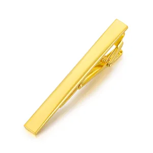 Gold brass tie clip detail shot, elegant men formal business suit accessory, minimalist design.