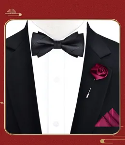 Men tuxedo accessory set detail showing black bow tie, burgundy rose brooch and pocket square.