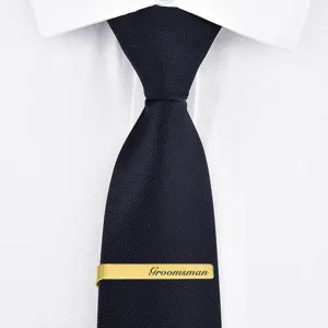 Gold stainless steel tie clip for men with custom laser engraved groom detail photo