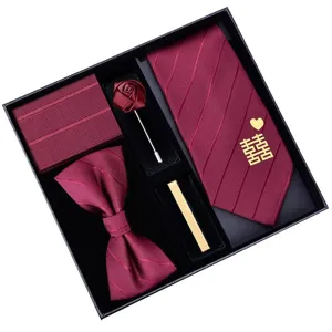 Burgundy wedding tie set for men, includes bow tie, pocket square, tie clip and lapel pin.
