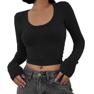 Detailed view of the women's black long sleeve crop top, featuring a classic scoop neckline.