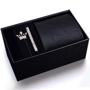 Details of men's black tie gift set featuring striped tie, silver crown brooch and tie clip.