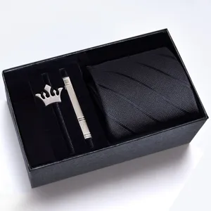 Black men's business tie gift set featuring striped necktie, crown brooch, and metal tie clip.