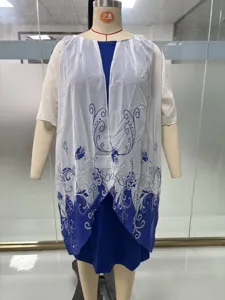 Plus size women summer two-piece outfit blue dress and white floral print cardigan.
