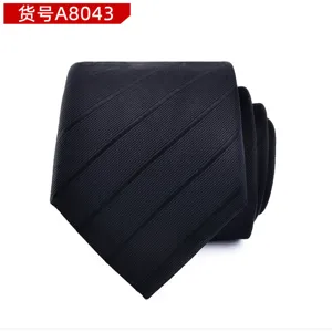 Detail shot of classic men's black diagonal striped tie, professional formal business wear accessory.