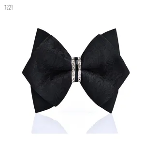 Black crystal bow tie detail, sharp corner design, elegant groom neckwear accessory.