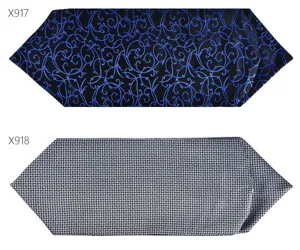 Men suit neckerchief detail view showing exquisite blue floral and geometric patterns.