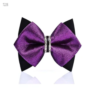 Detail view of men's purple and black crystal rhinestone pointed bow tie accessory.