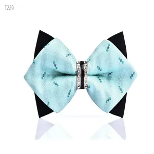Detail view of men's crystal rhinestone bow tie, light blue geometric pattern fabric.